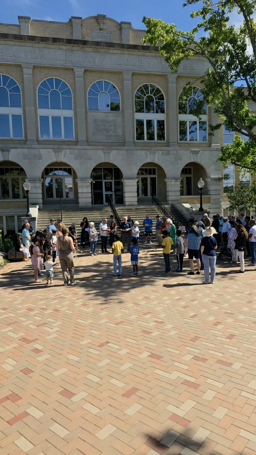 Catholics gathered in prayer on the Bentonville Square in front of the Benton County Courthouse during the inaugural 2026 Rosary Rally